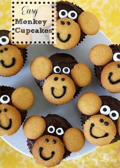 some cupcakes that are on a plate with eyes and nose drawn on them