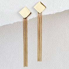 18Kt gold plated square fringe tassel earrings. Non fading. Arrives in logo drawstring protective pouch Trendy Fringe Jewelry Gift, Trendy Fringe Jewelry As Gift, Trendy Fringe Jewelry For Gifts, Trendy Fringed Jewelry As Gift, Gold Metal Tassel Earrings With Fringe, Gold Metal Fringe Tassel Earrings, Trendy Gold Fringe Earrings, Trendy Gold Tassel Earrings With Fringe, Gold Fringe Tassel Earrings