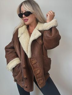 Rare find. Quality item. Genuine shearling. Super heavy and warm. Regular, relaxed fit.  Features:   V neck collar Two side pockets  Button closure Fully lined with wool Measures:  23" pit to pit  28" long  For reference I'm size small. Please check measurements before buying.  Overall in very good vintage condition - please see pictures for minor imperfections. No major flaws or bad smell. Looks great on both men and women. Message me for any questions.  All sales are final. Please read my stor Brown Shearling Outerwear For Fall, Brown Sherpa Outerwear With Faux Fur Lining, Brown Sherpa Outerwear With Pockets, Brown Shearling Fur Coat With Pockets, Brown Shearling Outerwear With Pockets, Brown Sherpa Outerwear For Cold Weather, Brown Leather Jacket With Pockets For Cold Weather, Brown Sheepskin Leather Jacket For Fall, Brown Aviator Leather Jacket With Pockets