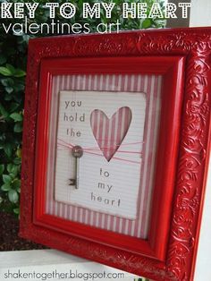 a red frame with a key to my heart and valentine's day card in it