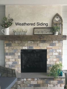 a living room with a fire place sitting under a sign that says weathered siding