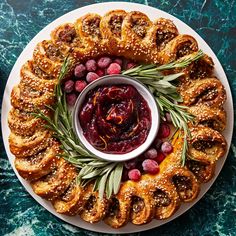 a white plate topped with cranberry sauce and pretzels