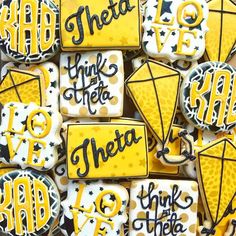 some cookies that are decorated with yellow and black icing