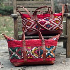 You're going to want to plan a weekend trip just so you can use this beautiful bag! Intertwined's beautifully crafted travel bag is handmade in Morocco from locally tanned leather and vintage, handwoven kilim. Each kilim is one-of-a-kind and handwoven with unique colors and patterns based on the region where it is made. Traditional Rectangular Weekender Bag For Travel, Traditional Brown Weekender Bag With Leather Handles, Traditional Woven Leather Shoulder Bag For Travel, Traditional Travel Bags With Leather Handles, Traditional Tote Weekender Bag For Travel, Traditional Travel Satchel With Leather Handles, Traditional Tote Travel Bag With Leather Handles, Traditional Travel Tote Bag With Leather Handles, Artisan Handwoven Travel Satchel