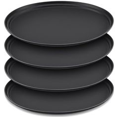 four black plates stacked on top of each other