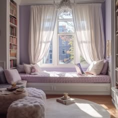 a bedroom with a window seat and bookshelf