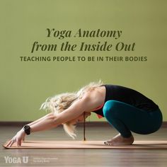 a woman is doing yoga on the floor with her hands behind her head and legs bent forward