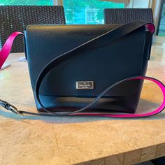 A Kate Spade Bag That Is In Perfect Condition! No Signs Of Wear! This Bag Was Purchased By Me At The Kate Spade Store Of My Local Mall And I Believe I Only Carried It A Dozen Times Or So. She Is A Classic Black With A Fun Pop Of Hot Pink On The Strap And Interior Of The Bag. The Hardware Has Zero Signs Of Being Carried. Kate Spade Store, Kate Spade Bag, Classic Black, Hot Pink, Kate Spade, Bag Lady, Drive, Signs, Pink