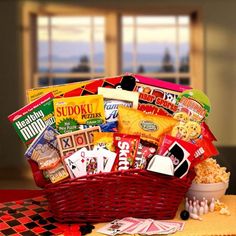 Fun & Games Gift Basket Fun times here we come, Send this fun filled and sweet treats gift basket to someone special today. A unique gift appropriate for many occasions we've included an assortment of fun and games as well as sweet treats. Includes An Uno game, a Tic-Tac-Toe wooden game set, an assortment of puzzle game books, Cracker Jacks, Famous Amos cookies and more. The Fun and Games Gift Basket includes: Checkers game set, word search puzzle book, Sudoku puzzle book, Crossword puzzle book, Games Gift Basket, Famous Amos Cookies, Get Well Gift Baskets, Raffle Ideas, Auction Basket, Auction Baskets, Raffle Basket, Red Basket, Peanut Candy