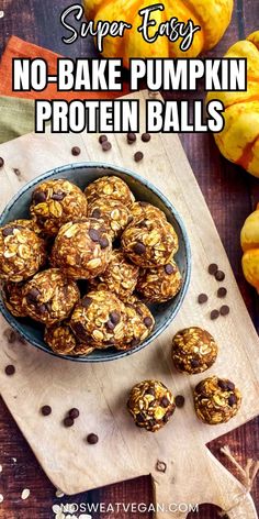 no bake pumpkin protein balls in a bowl on a cutting board with chocolate chips