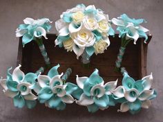 wedding bouquets with blue and white flowers in a wooden box