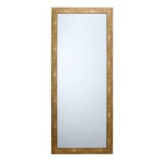 a large mirror sitting on top of a white wall next to a wooden framed object