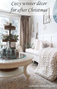 a living room filled with furniture and a large window covered in snowflakes