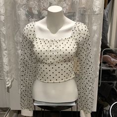 Turn Heads In This Sexy Blouse Crop Top And See Through Puffy Sleeves Pair With High Waisted Black Jeans Or Fox Leather Spanx For A Classy Sophisticated Look Trendy Long Sleeve Polka Dot Blouse, Polka Dot Long Sleeve Tops For Party, Polka Dot Long Sleeve Party Tops, Trendy Polka Dot Top For Night Out, Fitted Polka Dot Top For Spring, Casual Fitted Swiss Dot Blouse, Fitted Swiss Dot Top For Spring, Polka Dot Fitted Cropped Top, Fitted Cropped Polka Dot Top