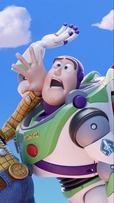 the character buzz lightyear from toy story is holding his arm up in front of him