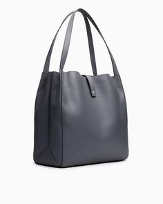 A highly versatile tote bag with contrasting straps, laptop compartment and pockets aplenty. 100% calf suede and leather trim. rag & bone Women's Large Tote Bag | Praline Suede Versatile Shoulder Tote With Gunmetal Hardware, Versatile Tote Shoulder Bag With Gunmetal Hardware, Versatile Shoulder Tote Bag With Gunmetal Hardware, Classic Hobo Bag With Leather Handles For On-the-go, Workwear Satchel With Gunmetal Hardware, Classic Workwear Bags With Gunmetal Hardware, Modern Work Bags With Gunmetal Hardware, Modern Workwear Bags With Gunmetal Hardware, Versatile Travel Hobo Bag With Gunmetal Hardware