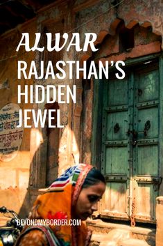 a woman is standing in front of an old building with the words alwar raaishan's hidden jewel