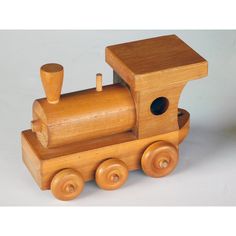 a wooden toy train sitting on top of a table