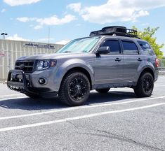 a silver truck parked in a parking lot