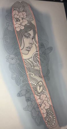 a woman's arm with flowers on it and an orange line in the middle