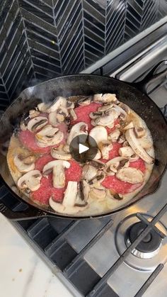 a skillet with food cooking on top of an oven