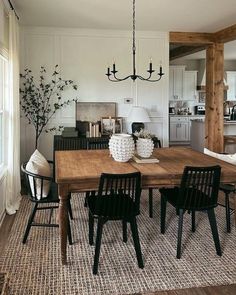 a dining room table with four chairs around it