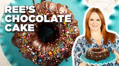 a woman holding a chocolate cake with sprinkles on it and the words reese's chocolate cake