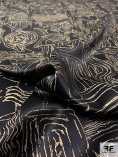 This interesting silk charmeuse fabric is gold foil printed with an archeological inspired design. The foil print gives the fabric a bit of "crispiness" and as a result, this charmeuse moves and drapes unlike a typical silk charmeuse. We highly encourage ordering a swatch first! SKU: 12538 Content: 100% Silk Color: Antique Gold / Black Width: 44 inches This fabric is a last cut and no longer in production. Once sold out, we are unable to get more. Gold Silk Fabric For Party, Formal Gold Silk Scarf, Foil Print Fabric, Black Silk Fabric, Wardrobe Colour, Black And Gold Aesthetic, Gold Wallpaper Background, Background Pics, Charmeuse Fabric