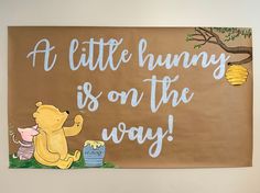 there is a sign on the wall that says a little bunny is on the way