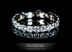 an image of a diamond ring on a black background