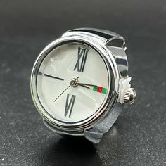 Tauche ein in die Eleganz und Praktikabilität mit unserer exquisiten Fingeruhr. Universale Passform durch leichtes Einstellen am Ring. Das schlanke Design und die hochwertige Verarbeitung machen sie zum perfekten Accessoire für jeden Anlass. Die präzise Uhrzeit ist immer griffbereit, direkt am Finger. Erlebe Luxus und Funktionalität in einem – die Fingeruhr, ein zeitloses Statement Ring Finger, Anniversary Rings, Jaeger Watch, Gifts For Wife, Gift For Lover, Fathers Day Gifts, Dangle Drop Earrings, Drop Earrings