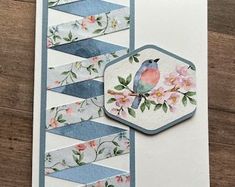 a card with a bird and flowers on it