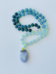 I love to use my voice and express myself. I speak my truth freely. I am honest about who I am. My throat chakra is balanced. This purchase includes: Gemstone Mala, baggie, card including using your mala, intention setting and properties. GEMSTONES Apatite: The stone is worn as a reminder for courage and confidence in pursuing one's goals. The stone has many layers of depth, with stunning shades of blue and grey. It is meant to inspire the wearer to live their truth. It is powerful for those on Gemstone Beads Amulet Necklace For Gift, Holistic Jewelry With 108 Beads For Gift, Spiritual Round Pendant With Gemstone Beads, Handmade Agate Spiritual Necklaces, Amulet Style Necklaces With Gemstone Beads For Gift, Amulet Style Necklaces With Gemstone Beads As Gifts, Amulet Style Necklace With Gemstone Beads As Gift, Handmade Agate Spiritual Necklace, Spiritual Jewelry With Round Gemstone Pendant