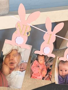 three pictures of babies hanging from clothes line with bunny ears and the name nb on them