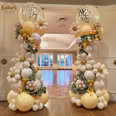 an entrance decorated with balloons and flowers