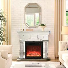 a living room with a fireplace and mirror