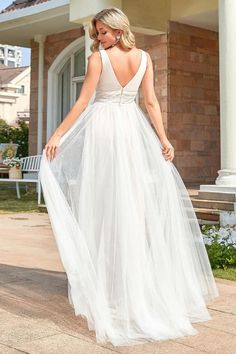 Walk down the aisle looking like a bohemian goddess in this splendid wedding dress. It exhibits a sleeveless bodice boasting flattering pleats, a deep v neck and an embellished waistband. It makes its way to a stunning long skirt showcasing a sheer pleated overlay. Fit: Please refer to Size Chart. Closure: It is Concealed a Zipper Up The Back. Undergarments: It is Padded, with Lining. Shell Fabric: 100%Polyester Lining Fabric: 100%Polyester Stretch: Fabric is Low Stretch. Plus Formal Dresses, Young Wedding, Long Wedding Dress, Puffed Long Sleeves, Round Neck Casual Dress, Sophisticated Bride, A Line Wedding Dress, Maxi Dress Prom, Wedding Dresses For Sale