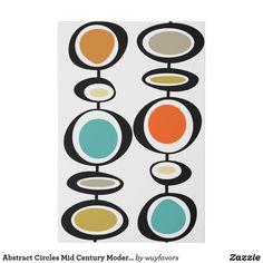 an abstract painting with circles and dots on white paper, showing the colors of different shapes