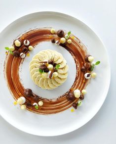 a white plate topped with food on top of a table