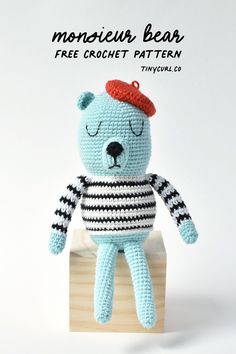 a crocheted teddy bear sitting on top of a wooden block with the caption monsieur bear free crochet pattern