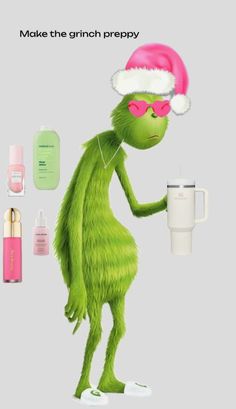 the grinch is wearing a santa hat and holding a cup