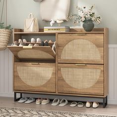 a wooden cabinet with baskets and shoes on it