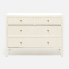 a white dresser with three drawers and gold handles