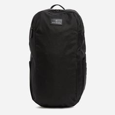 the back pack is black and has two zippers on each side, one for storage