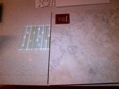 a kitchen counter top with a tile design on it