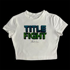 * Sublimated Title Fight band floral green cropped baby tee * Mannequin is wearing size XL * Mannequin measurements:    * Bust: 35" (C cup)    * Waist: 26"    * Hip: 40" * Soft, breathable, and stretchy material * For a looser fit, size up * Please note that all items are Made to Order & there may be slight variations in appearance Grunge Cropped T-shirt With Letter Print For Streetwear, Y2k Style Green Crop Top For Streetwear, Trendy Green T-shirt With Graffiti Print, Green Graphic Print Y2k Tops, Y2k Green Tops For Streetwear, Y2k Green Graphic Print Tops, Y2k Green Top For Streetwear, Green Y2k Style Top For Streetwear, Green Y2k Graphic Print Tops