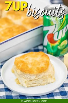 a piece of biscuit on a plate next to a can of 7up biscuits