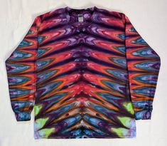 a long sleeved shirt with multicolored swirls on it