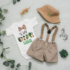 "[4pc set: Bodysuit or T-shirt (Incl Bow tie)/Shorts/Suspenders/Hat] [Top/Shorts/Suspenders: Bodysuit or T-shirt (Incl Bow tie)/Shorts/Suspenders] [Top/Shorts:  Bodysuit or T-shirt (incl Bow tie) and shorts] [Top only: Bodysuit or T-shirts (incl bowtie] [Top/suspenders : Bodysuit or T-shirts (incl bowtie)/suspenders] The current processing time is 3-5 business days. Processing time does not include shipping. Shipping charges are for USPS First Class Mail. Your orders will typically take 2-6 days Safari Birthday Outfit, Baby Safari Outfit, Shorts Bodysuit, Safari Outfit, Safari Outfits, Bowtie And Suspenders, Jungle Birthday, Birthday Party Outfits, Baby Boy Clothing Sets