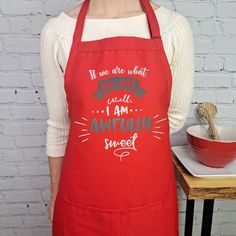 a woman wearing an apron with the words, baysdale music boys and kitchen tools on it